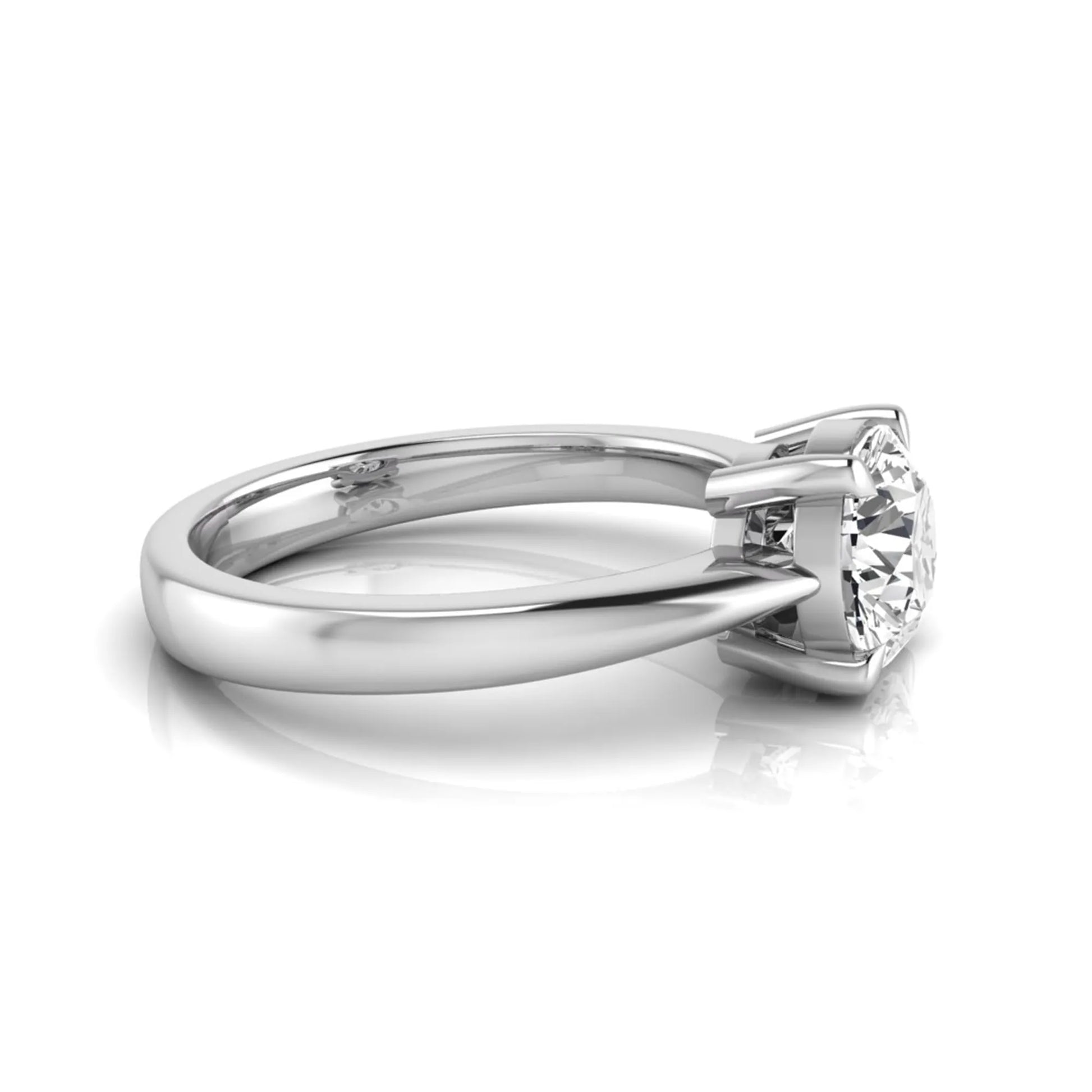 Round cut lab grown diamond solitaire engagement ring in white gold featuring a 1.28 carat IGI certified diamond.