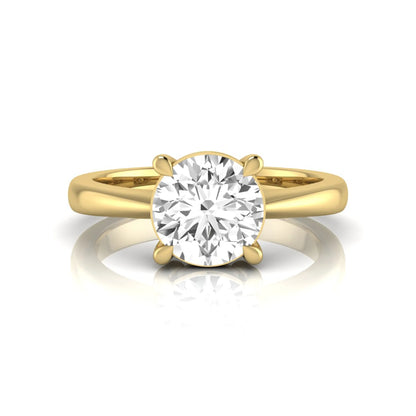 Round cut lab grown diamond solitaire engagement ring in yellow gold featuring a 1.28 carat IGI certified diamond.