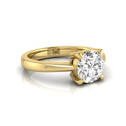 Round cut lab grown diamond solitaire engagement ring in yellow gold featuring a 1.28 carat IGI certified diamond.