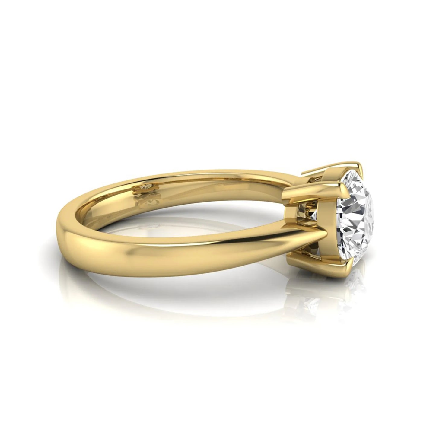 Round cut lab grown diamond solitaire engagement ring in yellow gold featuring a 1.28 carat IGI certified diamond.