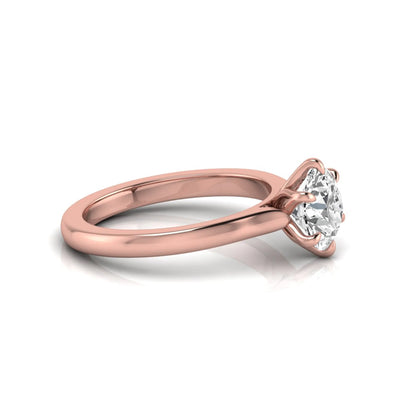 Round cut lab grown diamond solitaire engagement ring featuring a six-prong setting with a polished rose gold tone band.