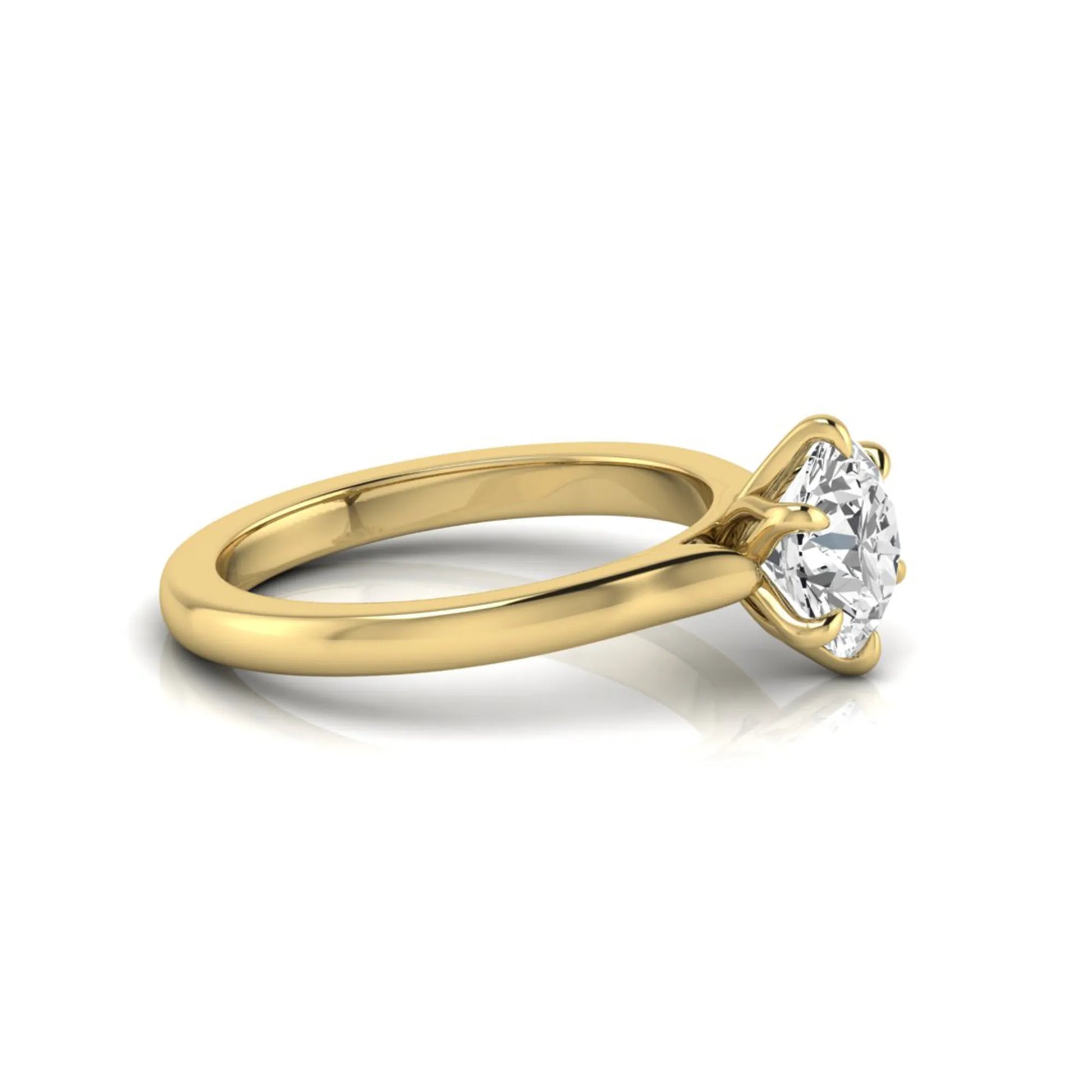 Round cut lab grown diamond solitaire engagement ring featuring a six-prong setting with a polished yellow gold tone band.