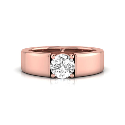 Round cut lab grown diamond solitaire engagement ring featuring a four-prong setting with a wide rose gold tone comfort-fit band.