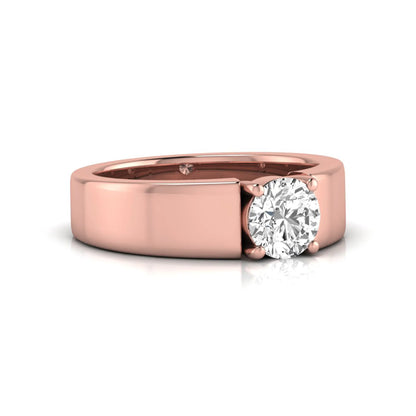 Round cut lab grown diamond solitaire engagement ring featuring a four-prong setting with a wide rose gold tone comfort-fit band.