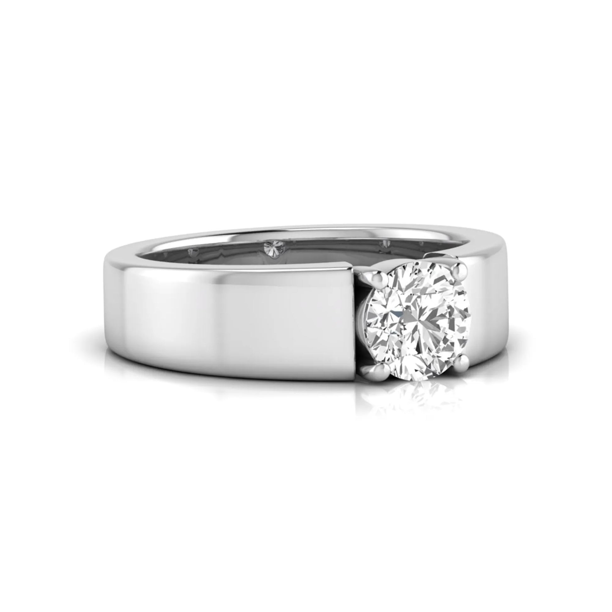 Round cut lab grown diamond solitaire engagement ring featuring a four-prong setting with a wide white gold tone comfort-fit band.