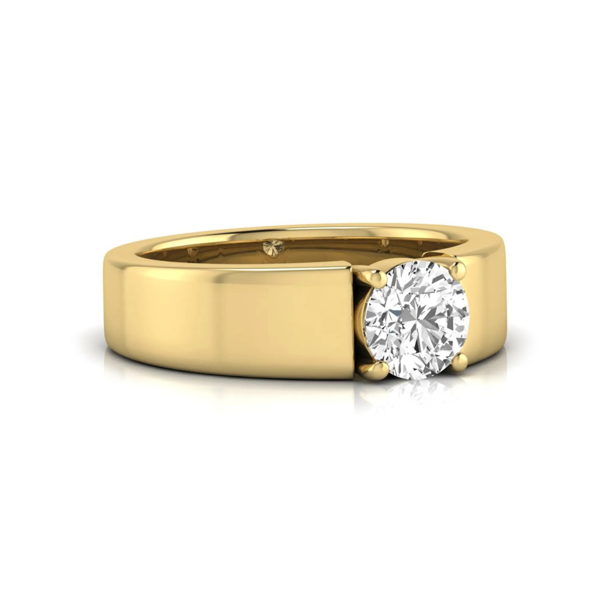 Round cut lab grown diamond solitaire engagement ring featuring a four-prong setting with a wide yellow gold tone comfort-fit band.