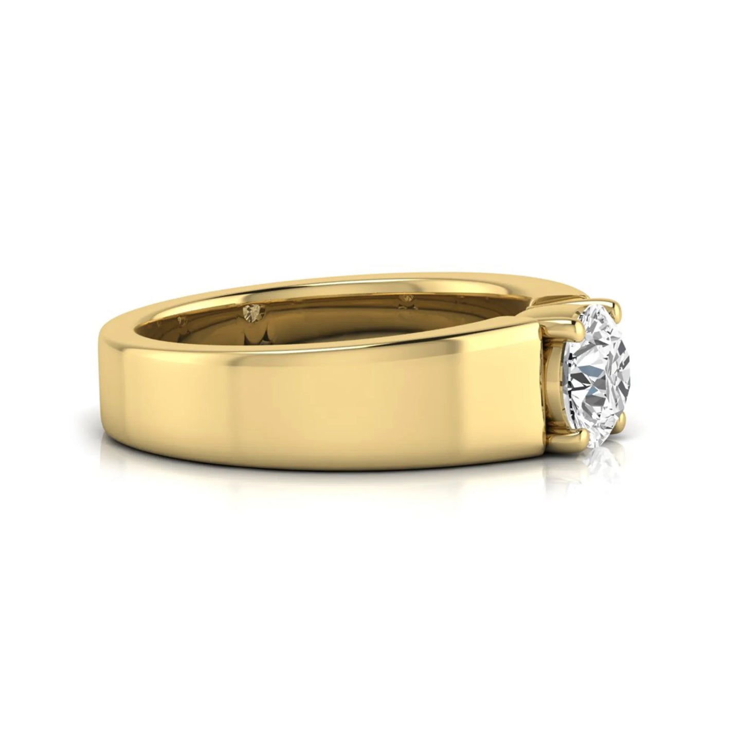 Round cut lab grown diamond solitaire engagement ring featuring a four-prong setting with a wide yellow gold tone comfort-fit band.
