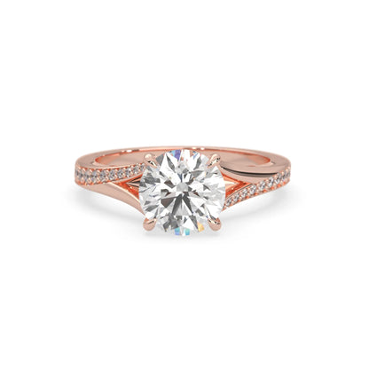 Rose gold ring with a large diamond on a white background