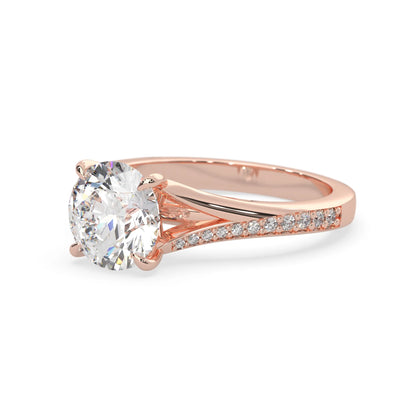 Rose gold ring with a large diamond and smaller diamonds on the band against a white background