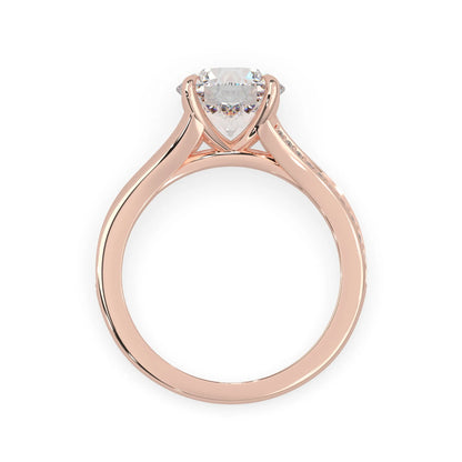 Rose gold ring with a heart-shaped diamond on a white background