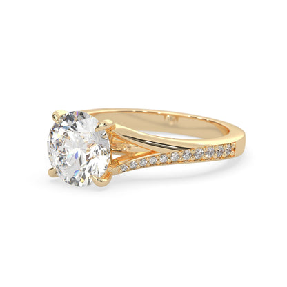 yellow Gold ring with a large diamond and smaller diamonds on the band against a white background