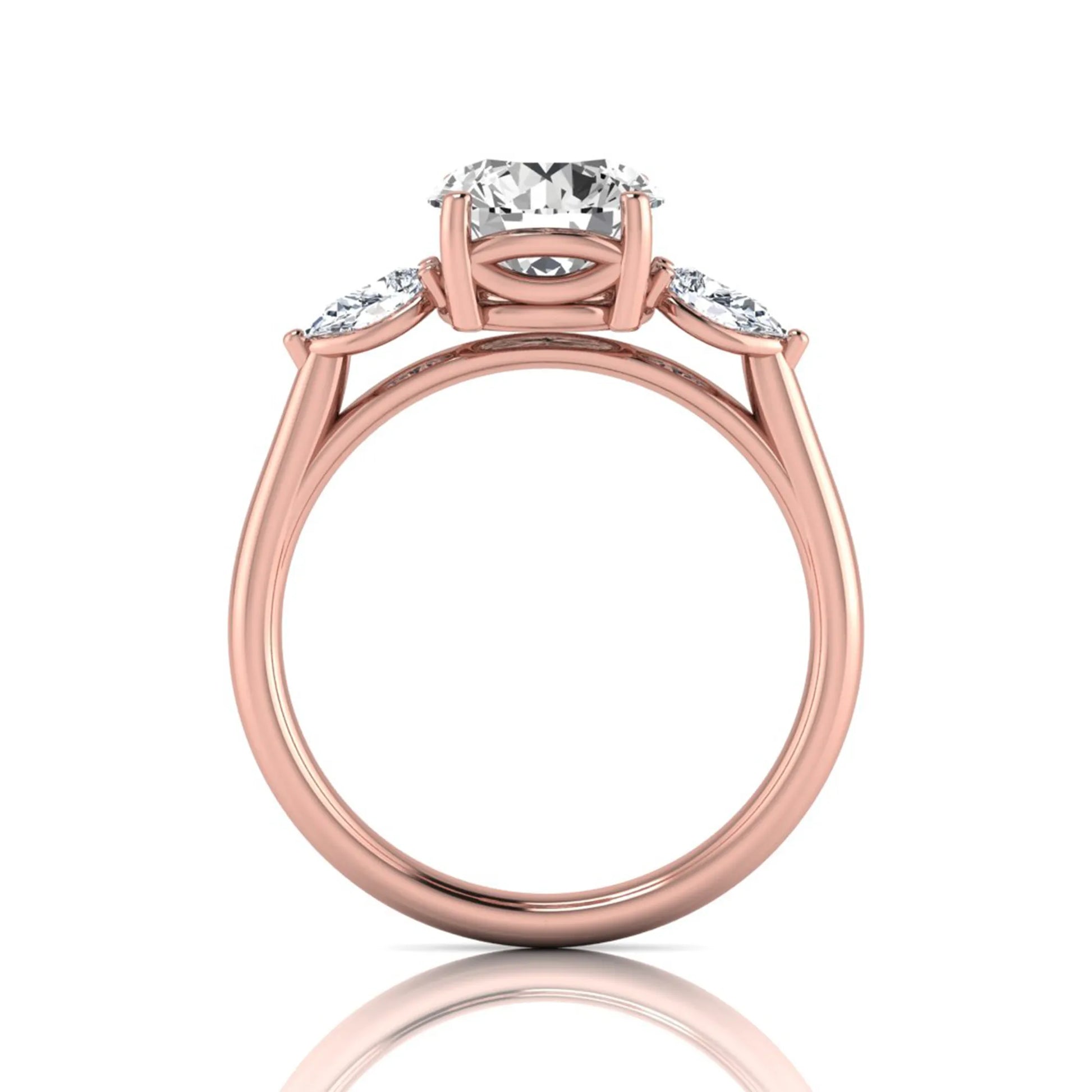 Round cut lab grown diamond three stone engagement ring featuring a 2.04 carat IGI certified center diamond with pear side diamonds in rose gold