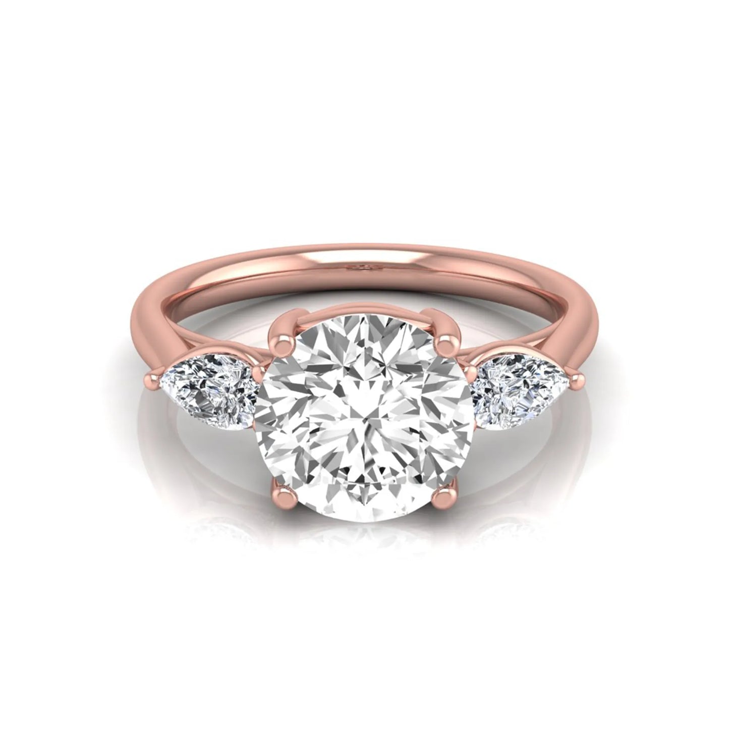 Round cut lab grown diamond three stone engagement ring featuring a 2.04 carat IGI certified center diamond with pear side diamonds in rose gold