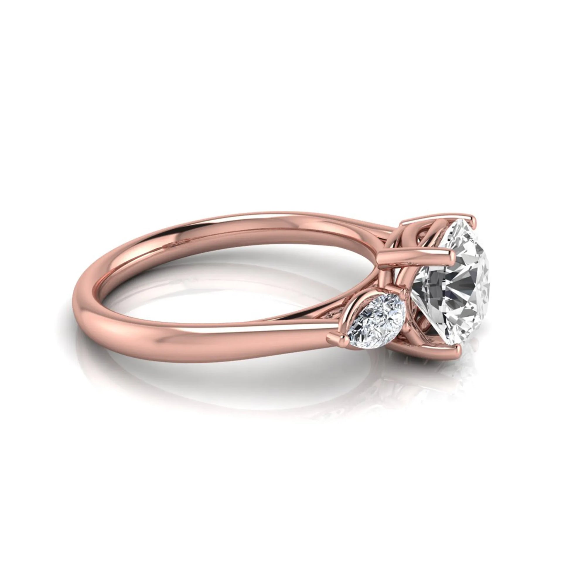 Round cut lab grown diamond three stone engagement ring featuring a 2.04 carat IGI certified center diamond with pear side diamonds in rose gold