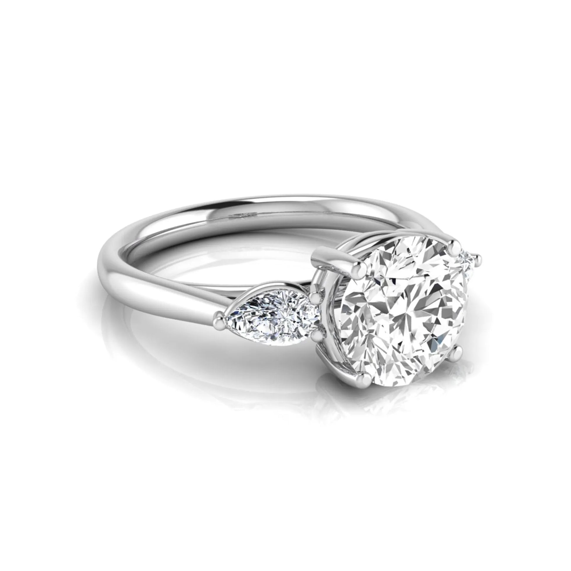 Round cut lab grown diamond three stone engagement ring featuring a 2.04 carat IGI certified center diamond with pear side diamonds in white gold