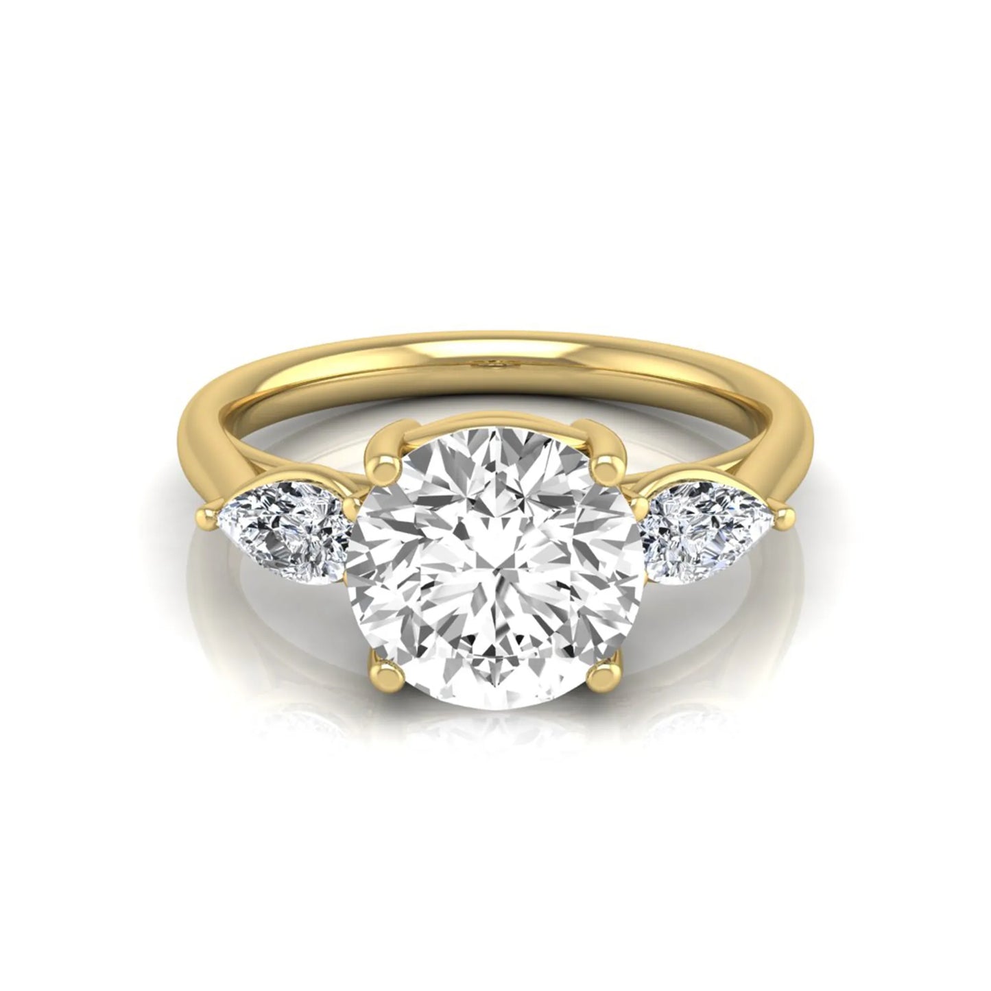 Round cut lab grown diamond three stone engagement ring featuring a 2.04 carat IGI certified center diamond with pear side diamonds in yellow gold