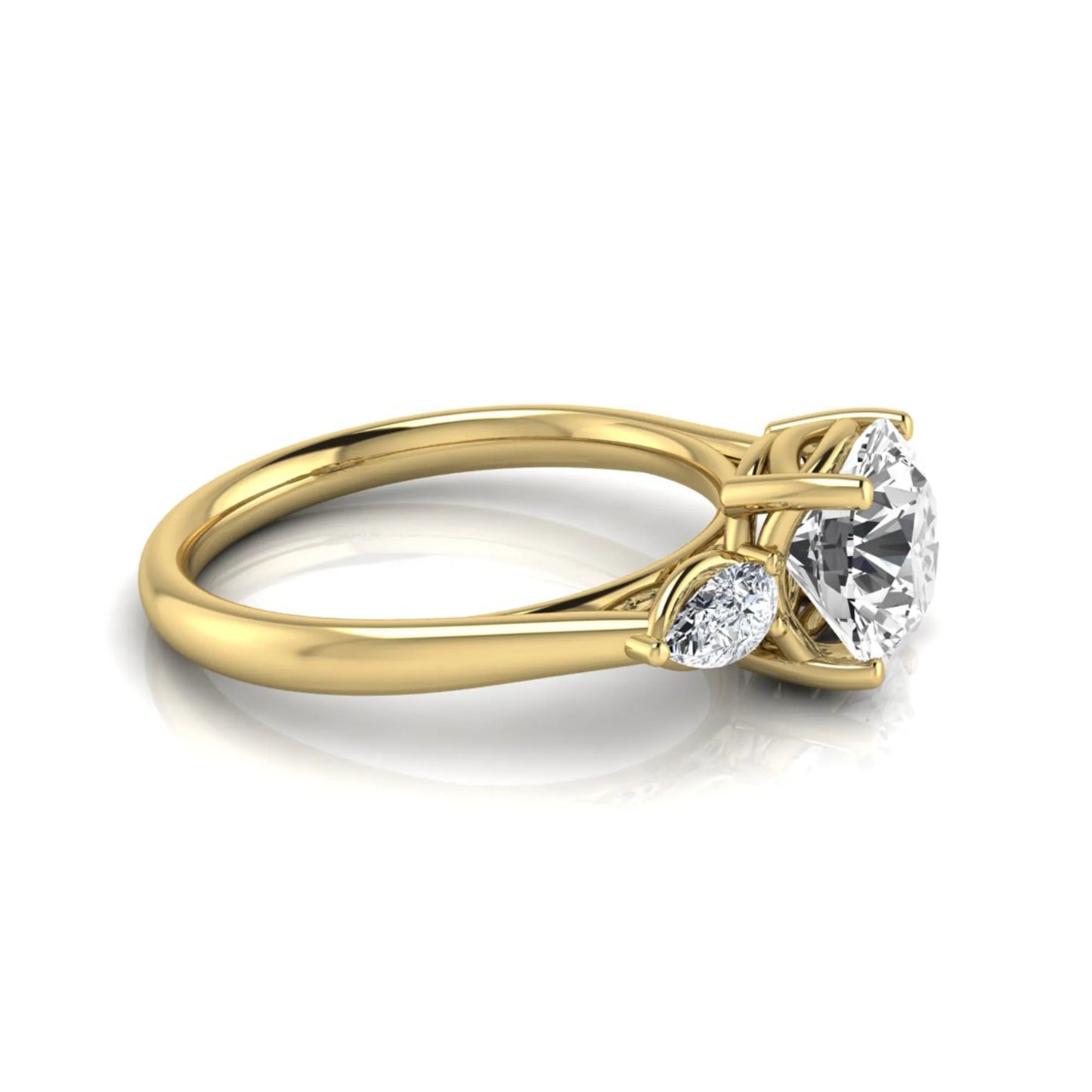 Round cut lab grown diamond three stone engagement ring featuring a 2.04 carat IGI certified center diamond with pear side diamonds in yellow gold