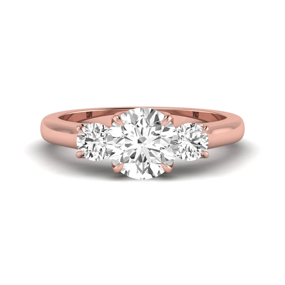 IGI certified round cut lab grown diamond three stone engagement ring with round side diamonds in rose gold.