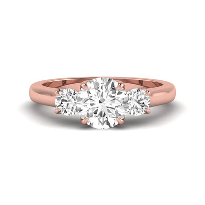 IGI certified round cut lab grown diamond three stone engagement ring with round side diamonds in rose gold.