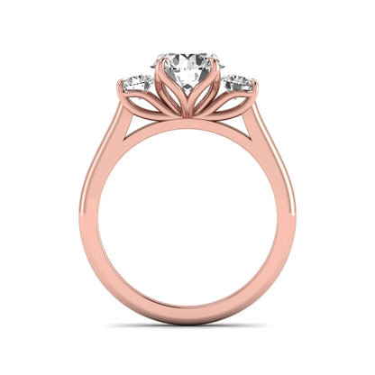 IGI certified round cut lab grown diamond three stone engagement ring with round side diamonds in rose gold.