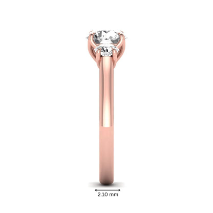IGI certified round cut lab grown diamond three stone engagement ring with round side diamonds in rose gold.
