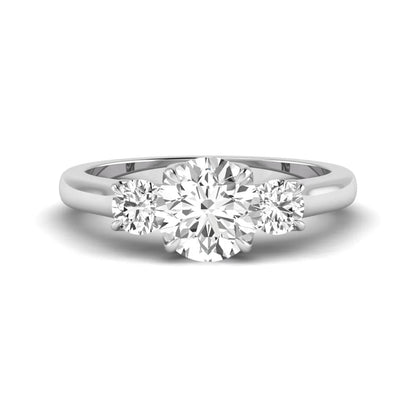 IGI certified round cut lab grown diamond three stone engagement ring with round side diamonds in white gold.