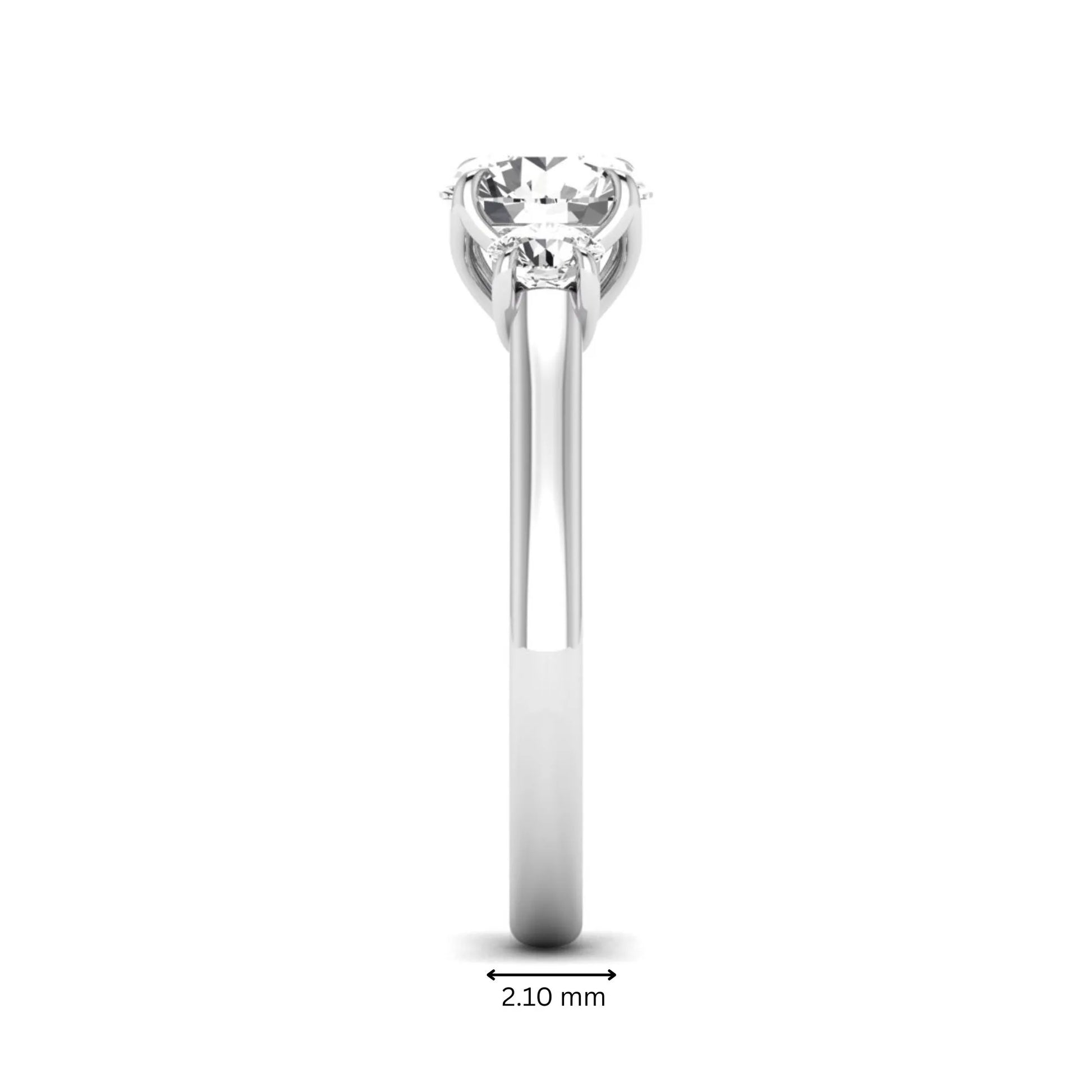 IGI certified round cut lab grown diamond three stone engagement ring with round side diamonds in white gold.
