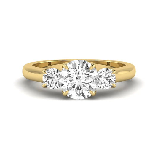 IGI certified round cut lab grown diamond three stone engagement ring with round side diamonds in yellow gold.