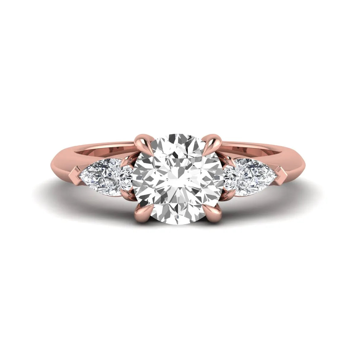 IGI certified round cut lab grown diamond three stone engagement ring with pear side diamonds in rose gold.
