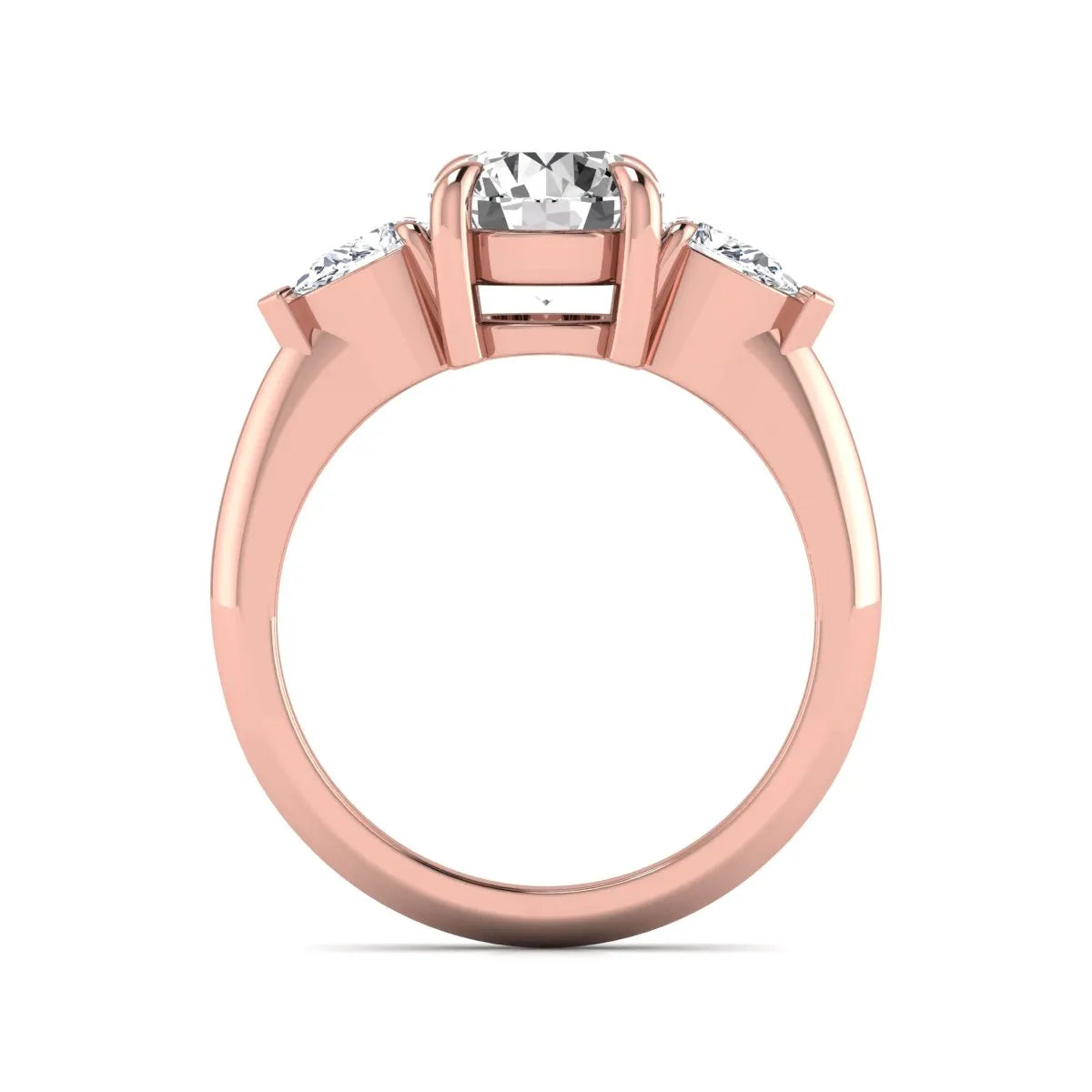 IGI certified round cut lab grown diamond three stone engagement ring with pear side diamonds in rose gold.