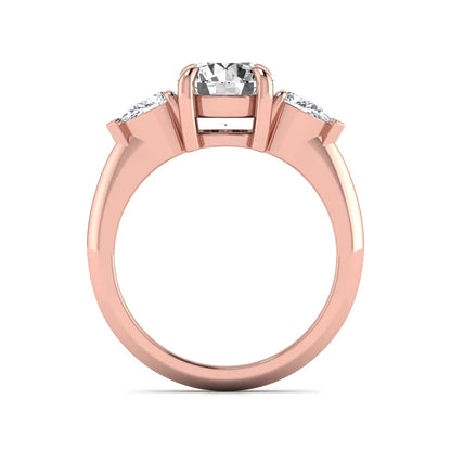 IGI certified round cut lab grown diamond three stone engagement ring with pear side diamonds in rose gold.