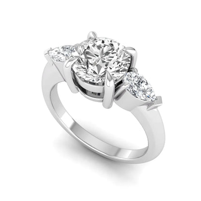 IGI certified round cut lab grown diamond three stone engagement ring with pear side diamonds in white gold.