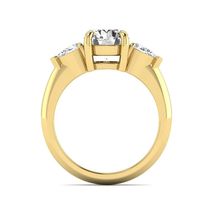 IGI certified round cut lab grown diamond three stone engagement ring with pear side diamonds in yellow gold.