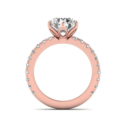 Round cut lab grown diamond pavé solitaire engagement ring with cathedral setting in rose gold.