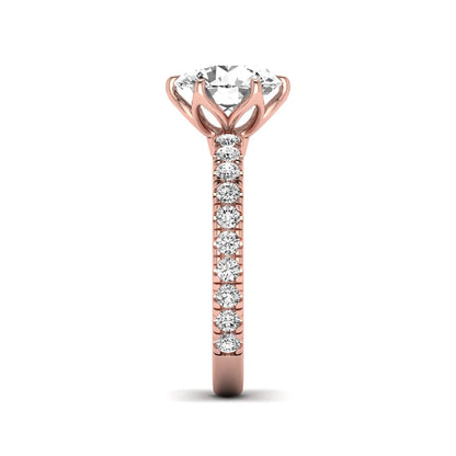 Round cut lab grown diamond pavé solitaire engagement ring with cathedral setting in rose gold.