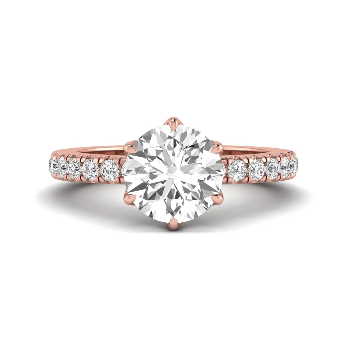 Round cut lab grown diamond pavé solitaire engagement ring with cathedral setting in rose gold.
