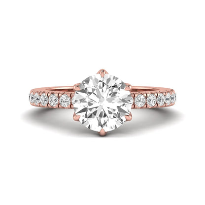 Round cut lab grown diamond pavé solitaire engagement ring with cathedral setting in rose gold.