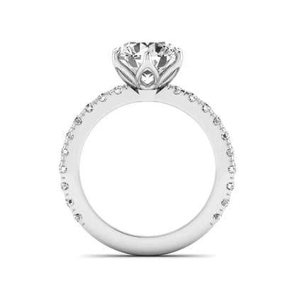 Round cut lab grown diamond pavé solitaire engagement ring with cathedral setting in white gold.