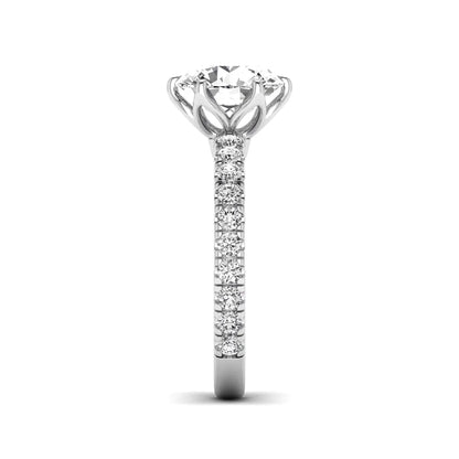 Round cut lab grown diamond pavé solitaire engagement ring with cathedral setting in white gold.