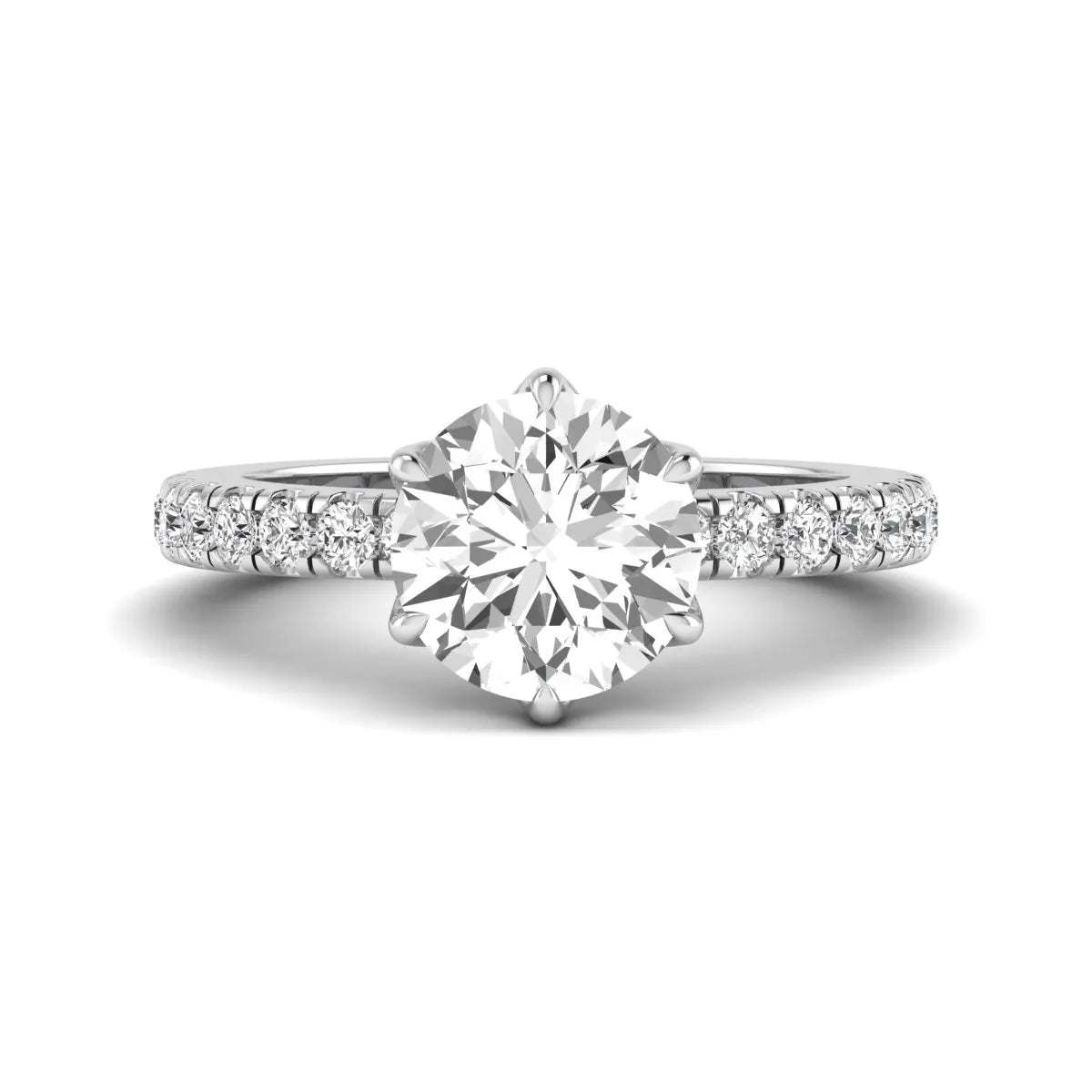 Round cut lab grown diamond pavé solitaire engagement ring with cathedral setting in white gold.