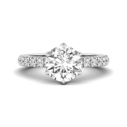 Round cut lab grown diamond pavé solitaire engagement ring with cathedral setting in white gold.
