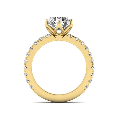 Round cut lab grown diamond pavé solitaire engagement ring with cathedral setting in yellow gold.