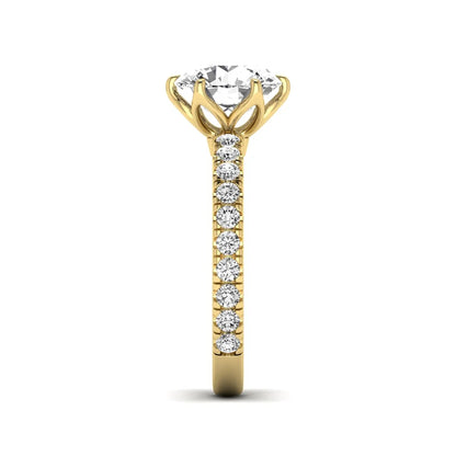 Round cut lab grown diamond pavé solitaire engagement ring with cathedral setting in yellow gold.