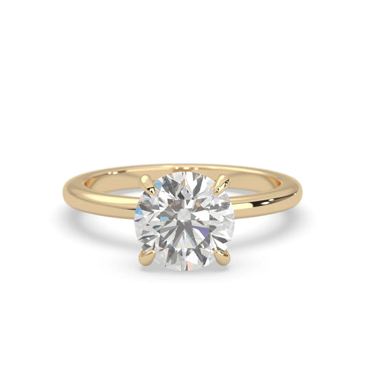 yellow-Gold ring with a large diamond on a white background