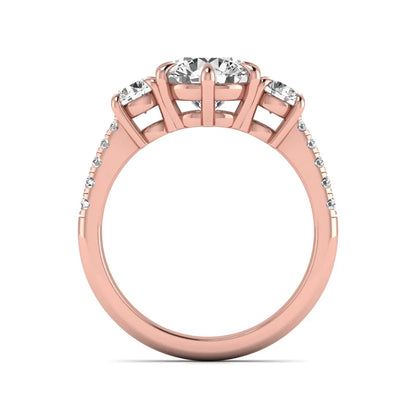 Round cut lab grown diamond three stone engagement ring with two round side diamonds and diamond accented shoulders in rose gold
