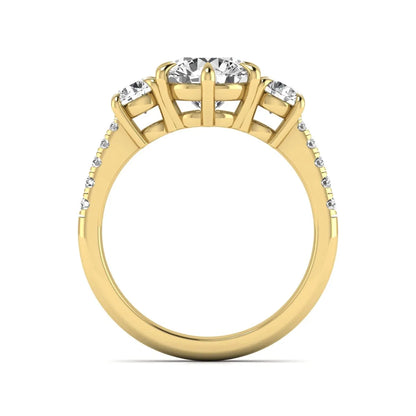 Round cut lab grown diamond three stone engagement ring with two round side diamonds and diamond accented shoulders in yellow gold