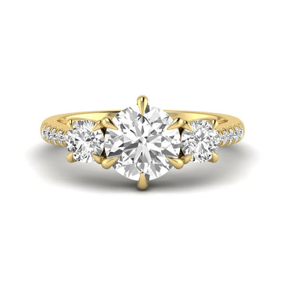 Round cut lab grown diamond three stone engagement ring with two round side diamonds and diamond accented shoulders in yellow gold