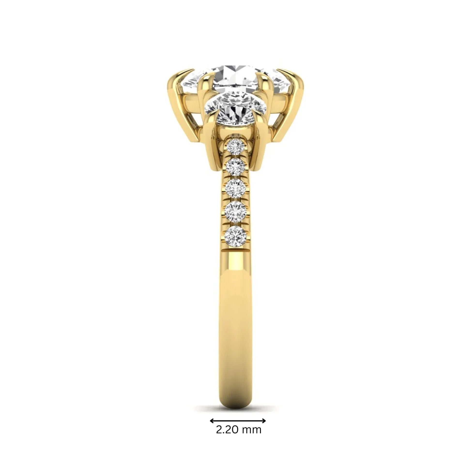 Round cut lab grown diamond three stone engagement ring with two round side diamonds and diamond accented shoulders in yellow gold