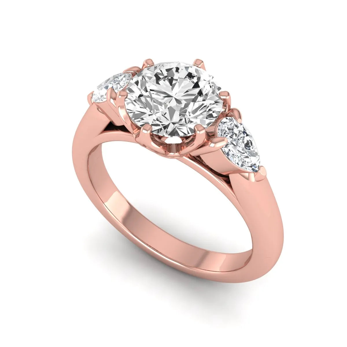 Round cut lab grown diamond three stone engagement ring with pear side diamonds in rose gold.