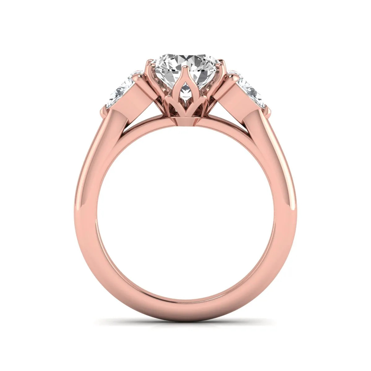 Round cut lab grown diamond three stone engagement ring with pear side diamonds in rose gold.